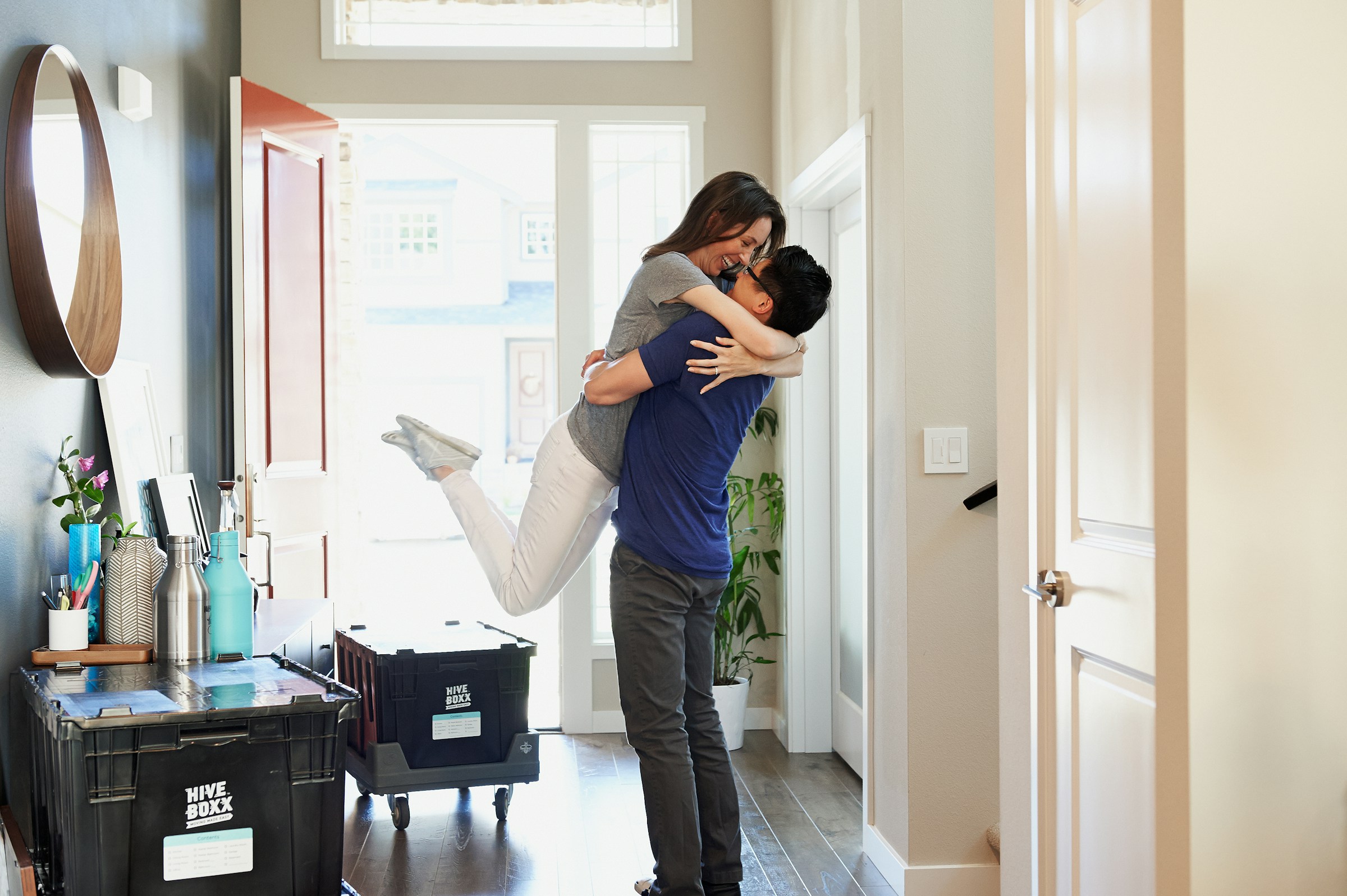 Professional movers carrying boxes